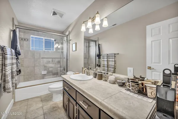 a picture of a bathroom with a shower