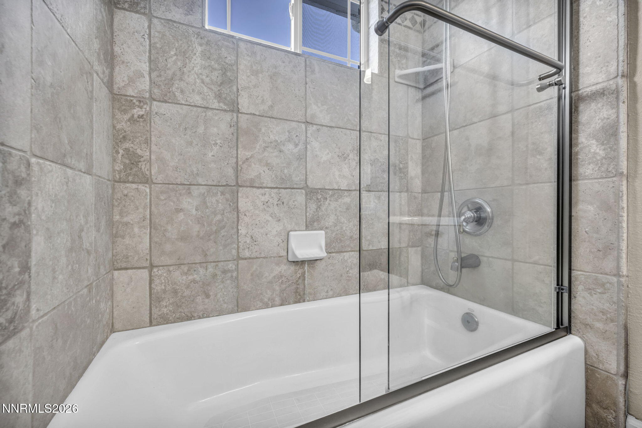 2296 Oak Ridge Drive Carson City, NV 89703 - Photo 52 of 72 a bathroom with a tub and a shower