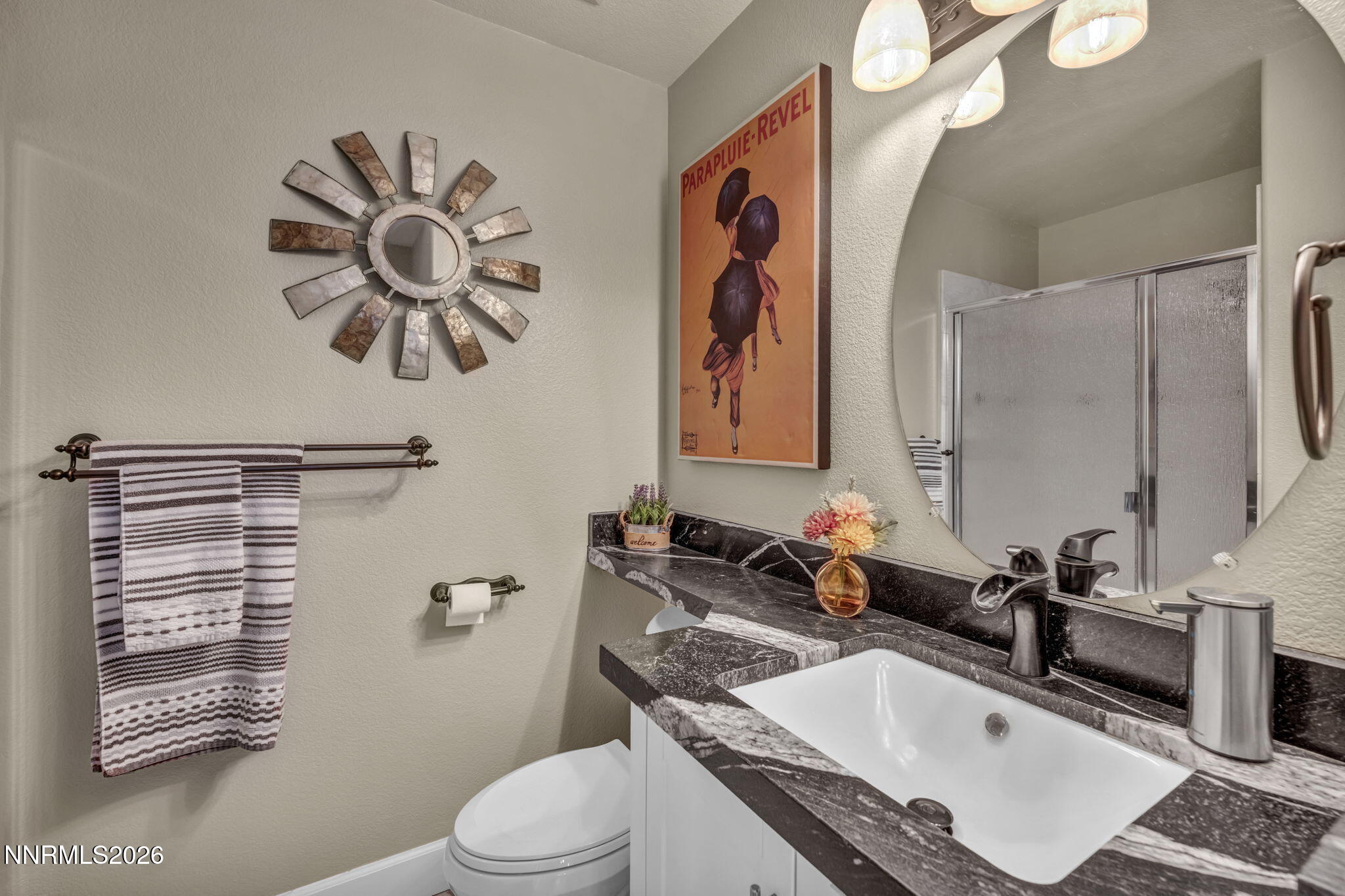 2296 Oak Ridge Drive Carson City, NV 89703 - Photo 53 of 72 a bathroom with a sink a toilet and shower