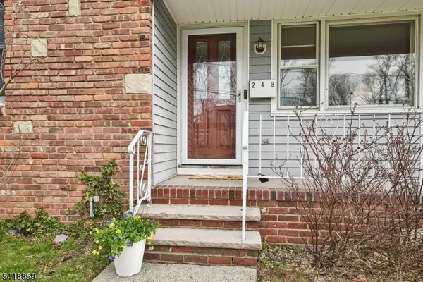 a front view of a house with a porch