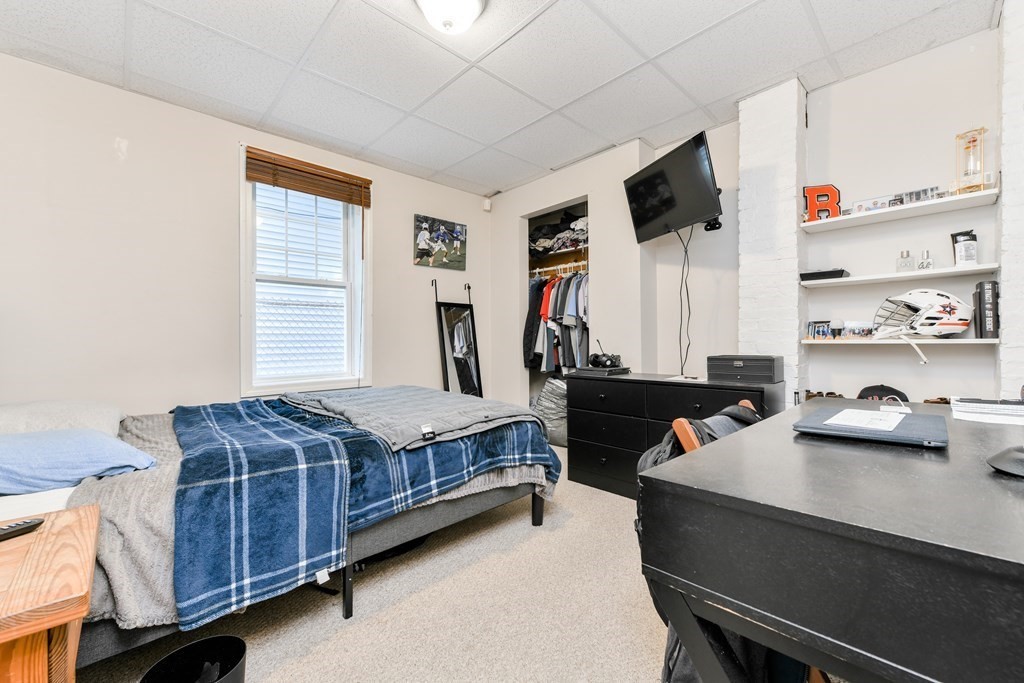748 East 3rd Street, Unit A Boston, MA 02127 - Photo 9 of 16 a bedroom with bed and a window