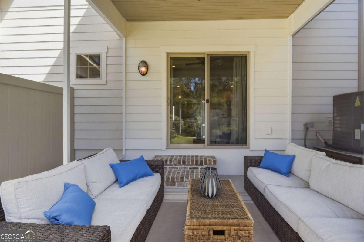 203 Mariners Circle St. Simons, GA 31522 - Photo 16 of 32 a view of a couch in the balcony