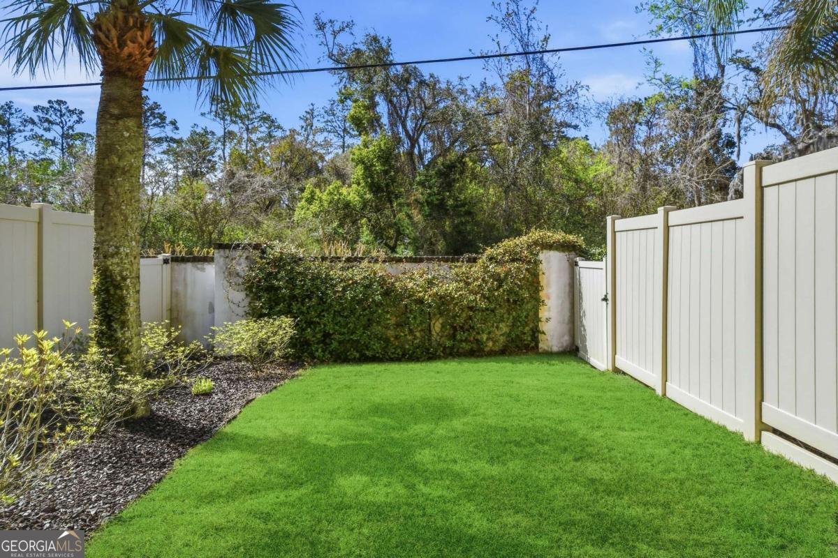 203 Mariners Circle St. Simons, GA 31522 - Photo 17 of 32 a view of a back yard of the house