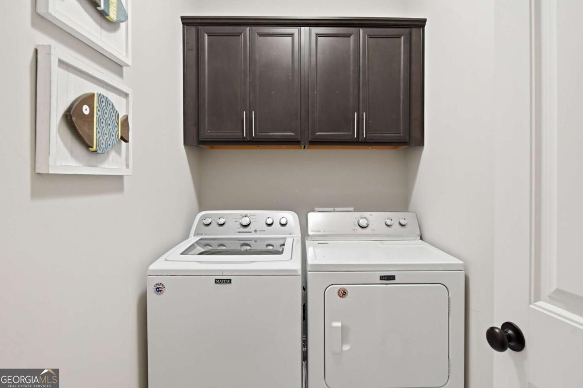 203 Mariners Circle St. Simons, GA 31522 - Photo 27 of 32 a utility room with dryer and washer