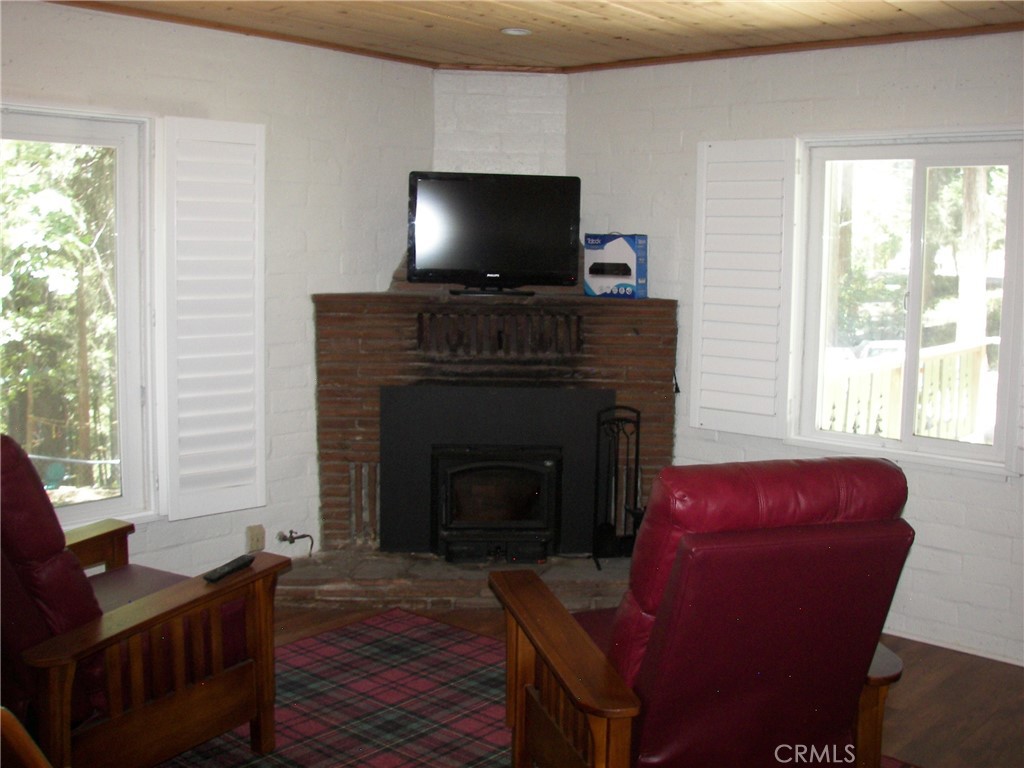 1101 Big Tree Lane Crestline, CA 92325 - Photo 10 of 30 a living room with furniture and a fireplace