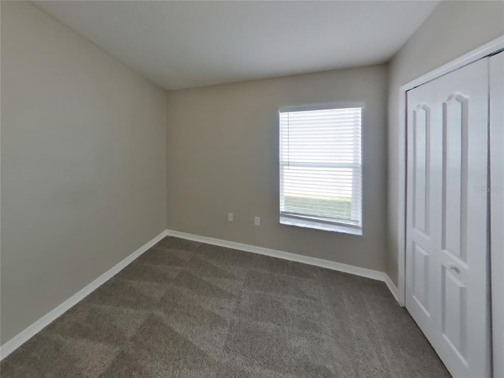 Undisclosed Address Land O Lakes, FL 34639 - Photo 11 of 15 a view of an empty room with a window