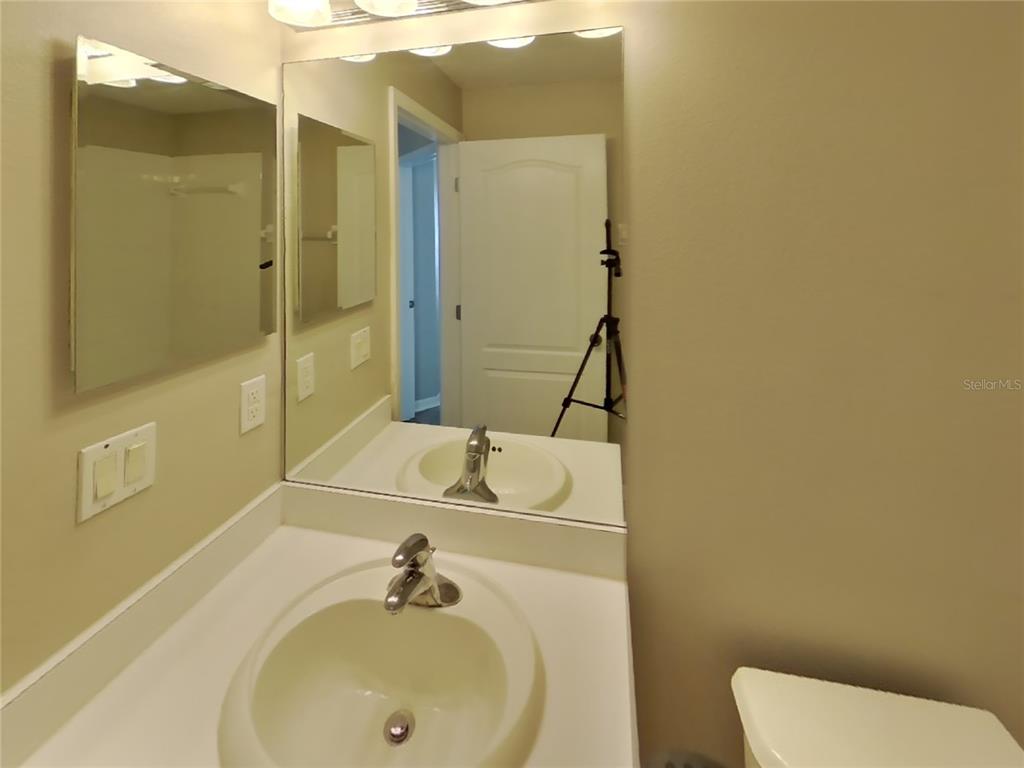 Undisclosed Address Land O Lakes, FL 34639 - Photo 13 of 15 a bathroom with a sink and a tub