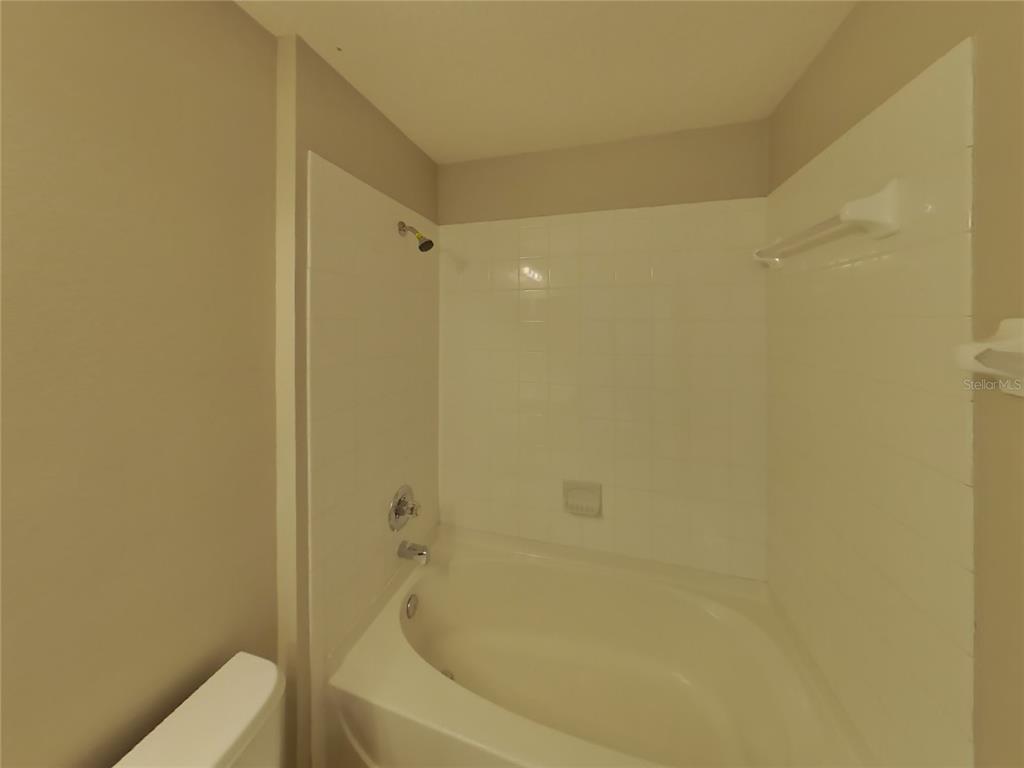 Undisclosed Address Land O Lakes, FL 34639 - Photo 14 of 15 a bathroom with a bathtub