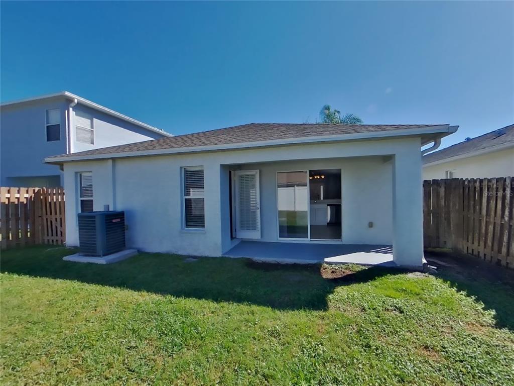 Undisclosed Address Land O Lakes, FL 34639 - Photo 15 of 15 a front view of a house with a yard and porch