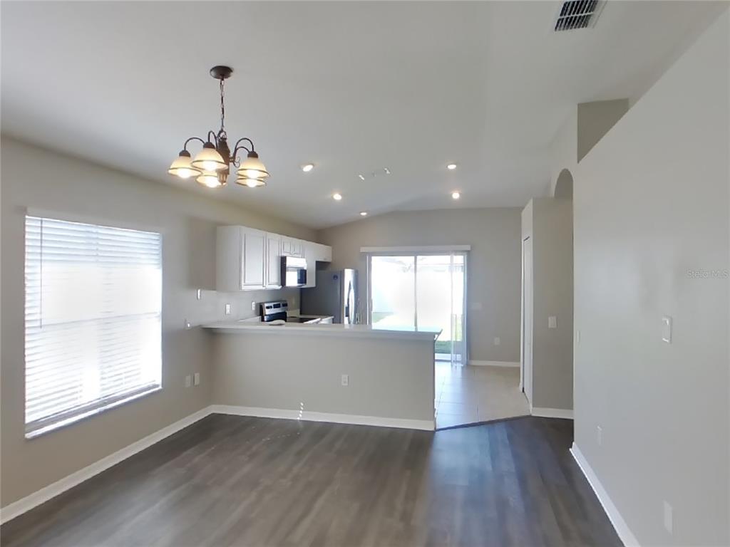 Undisclosed Address Land O Lakes, FL 34639 - Photo 4 of 15 a view of a kitchen and a sink wooden floor windows