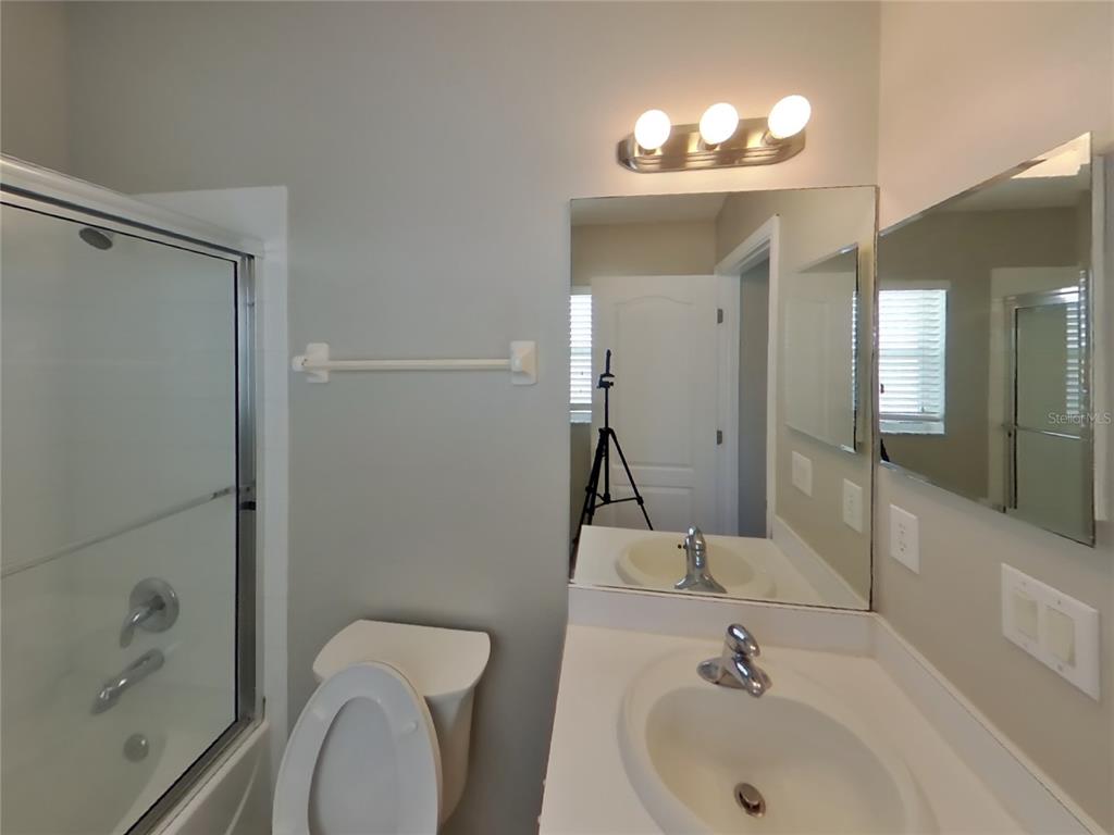 Undisclosed Address Land O Lakes, FL 34639 - Photo 9 of 15 a bathroom with a sink toilet and shower