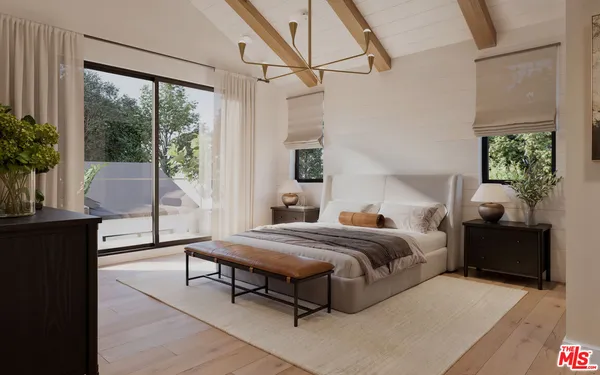 a spacious bedroom with a bed and wooden floor