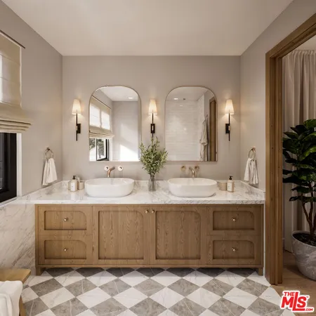 a bathroom with a double vanity sink and mirror