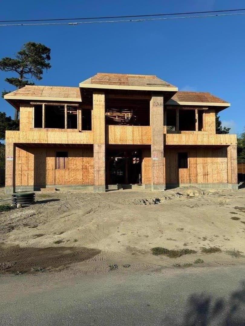 1029 Rodeo Road Pebble Beach, CA 93953 - Photo 9 of 10 a front view of a house with a yard