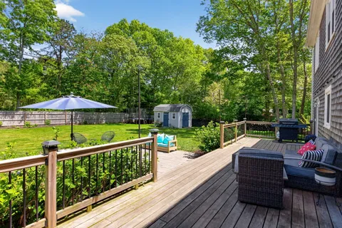 a view of a swimming pool with a patio and yard