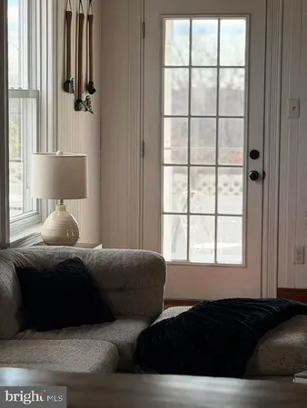 a room with furniture and a wooden floor