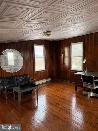 a view of a door and wooden floor
