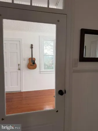 a bedroom with a bed and a black cabinet