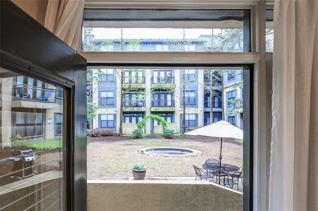 400 17th Street Northwest, Unit 2104 Atlanta, GA 30363 - Photo 1 of 1 Direct access to huge gated inner courtyard with grill, seating and green space.