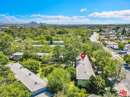an aerial view of residential house with an outdoor space