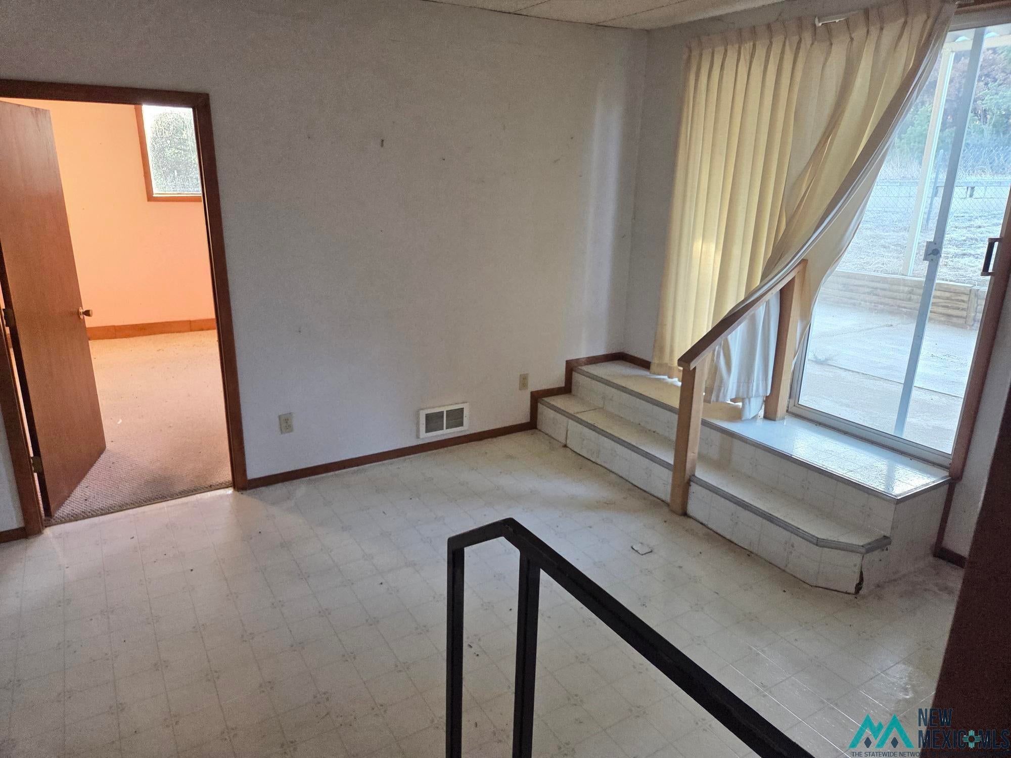 1522 Hogan Street Raton, NM 87740 - Photo 8 of 13 Unfurnished room with baseboards and light floors
