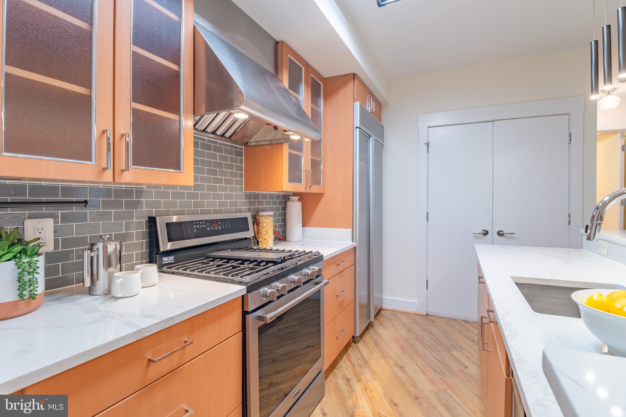 1735 Johnson Avenue Northwest, Unit B Washington, DC 20009 - Photo 12 of 34 a kitchen with a sink and a stove top oven