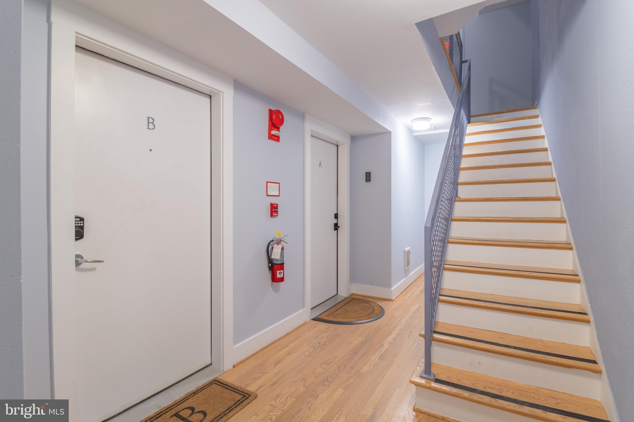 1735 Johnson Avenue Northwest, Unit B Washington, DC 20009 - Photo 5 of 34 a view of entryway with stairs and white wooden floor