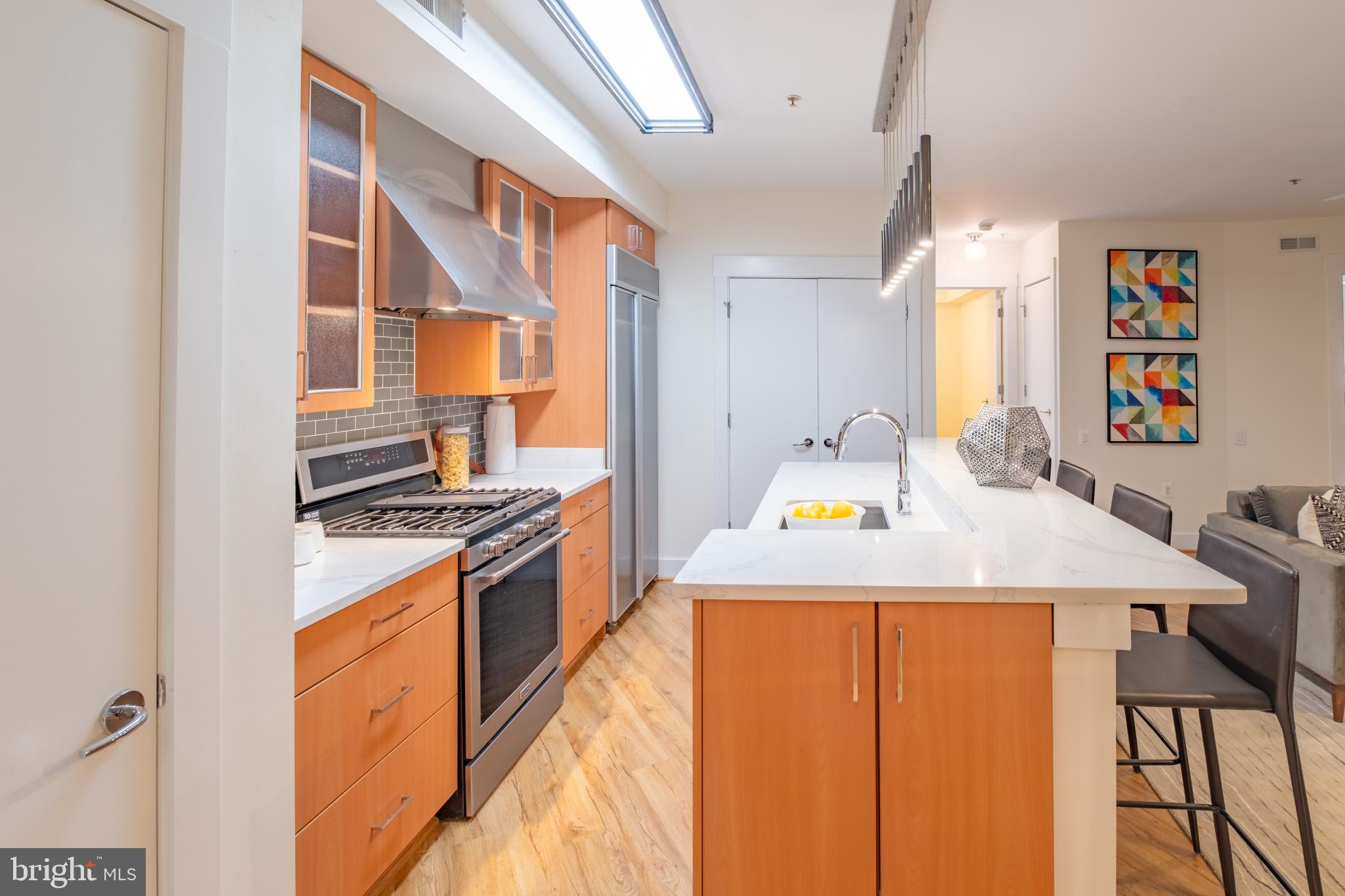 1735 Johnson Avenue Northwest, Unit B Washington, DC 20009 - Photo 10 of 34 a kitchen that has a stove and a table