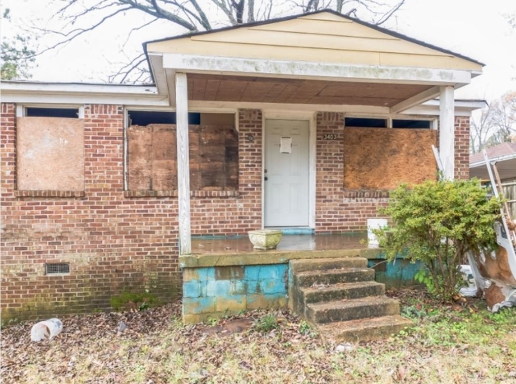 3403 Dillard Road Memphis, TN 38128 - Photo 13 of 17 a front view of a house with a yard