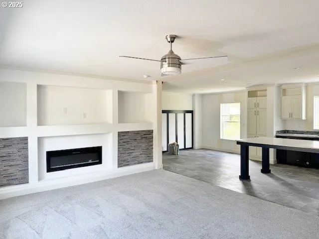 a view of livingroom with furniture fireplace and window