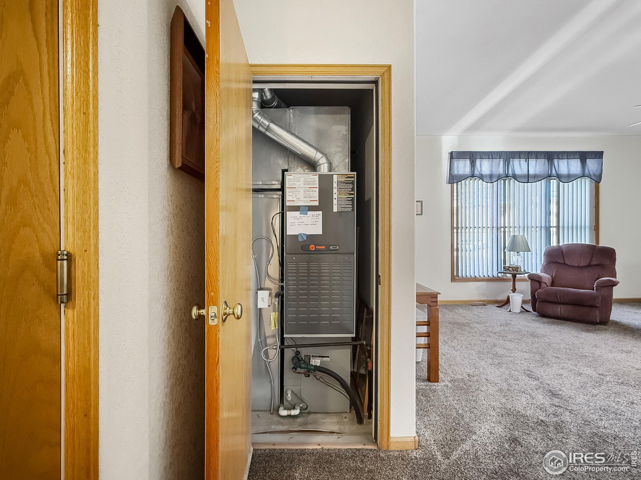 817 Mindy Circle, Unit B Sterling, CO 80751 - Photo 14 of 34 a living room with furniture and a walk in closet
