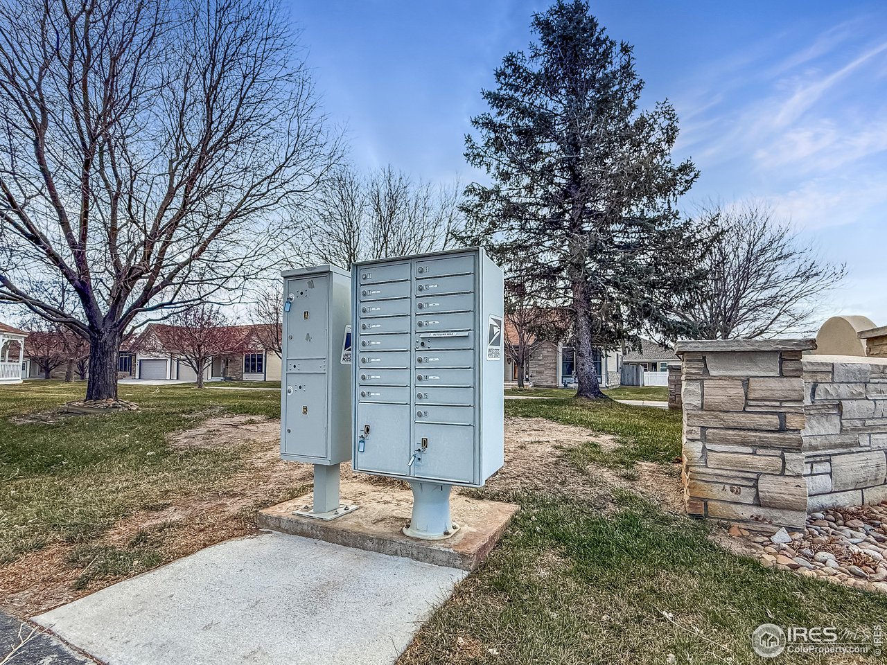817 Mindy Circle, Unit B Sterling, CO 80751 - Photo 32 of 34 a view of a house with a yard and garage