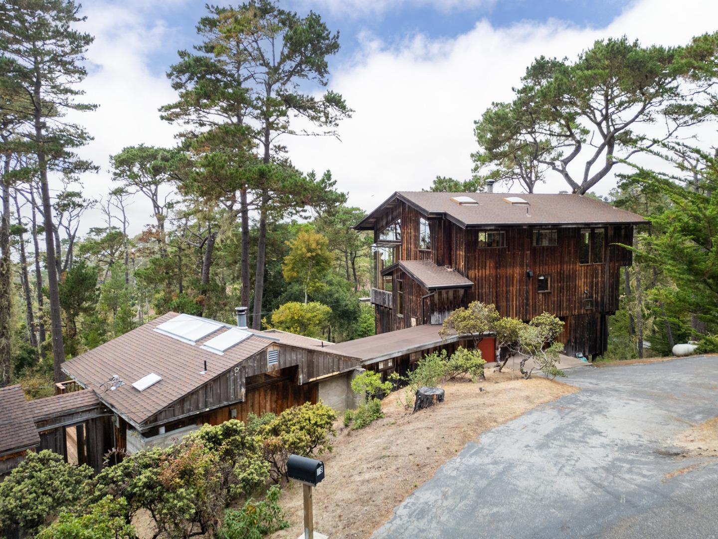 73 Mt Devon Road Carmel Highlands, CA 93923 - Photo 81 of 88 an aerial view of a house with backyard space and balcony