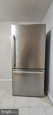 a white refrigerator freezer sitting in a kitchen