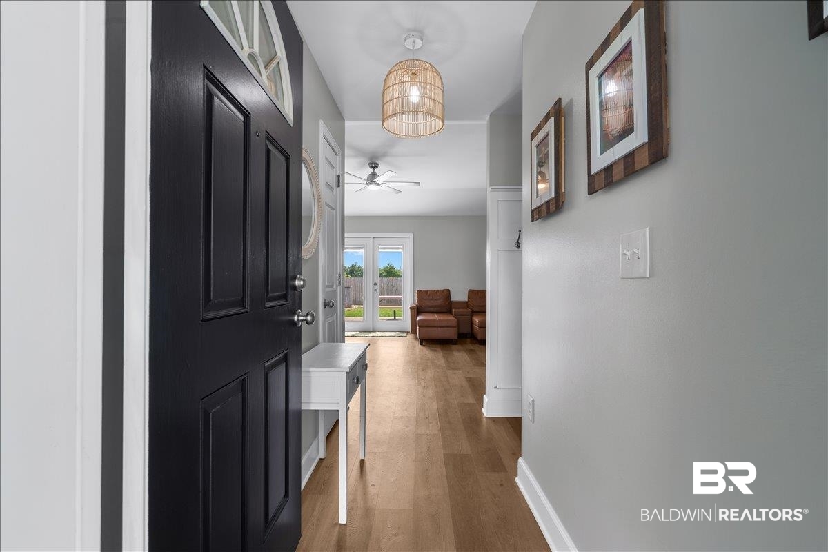 8952 Sherman Road Foley, AL 36535 - Photo 9 of 41 Inviting entryway featuring a dark paneled door with an arched transom