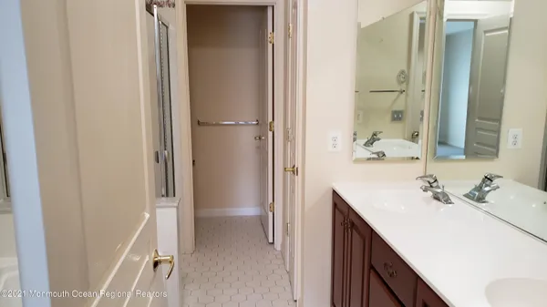a bathroom with a shower and a sink