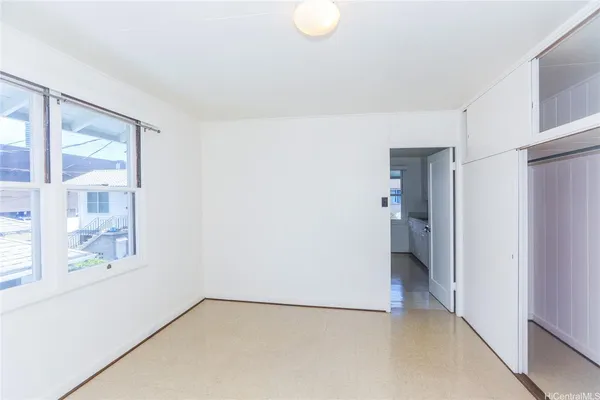 a view of a room with a hallway and a bathroom