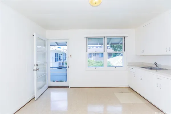 a view of a kitchen with a sink dishwasher and a microwave oven