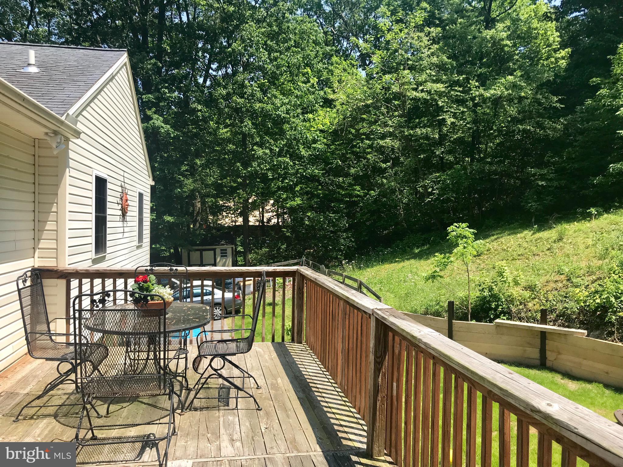 4253 Rinehart Road Westminster, MD 21158 - Photo 23 of 31 A deck, patio, and lots of yard for entertaining.