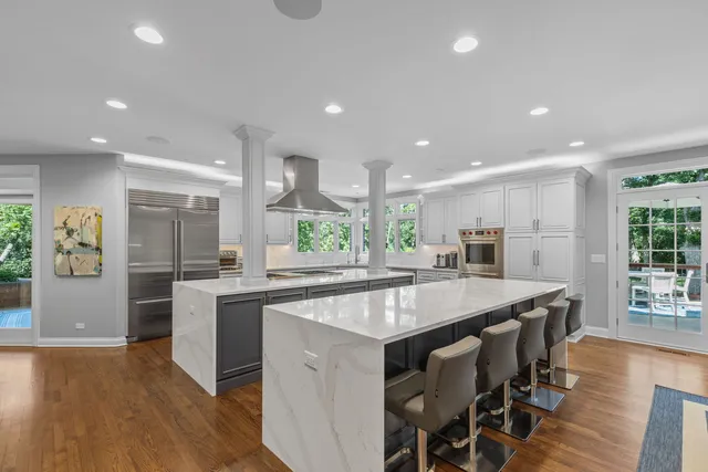 a kitchen with stainless steel appliances a stove top oven