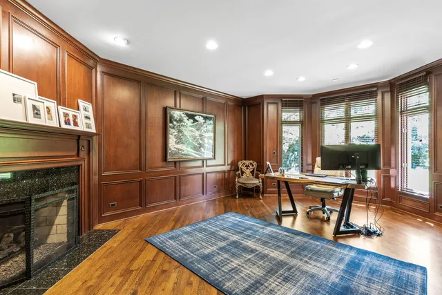 a bedroom with a large bed and a tv