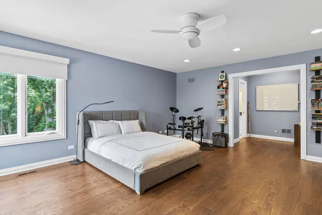 a bathroom with a toilet a sink and a mirror
