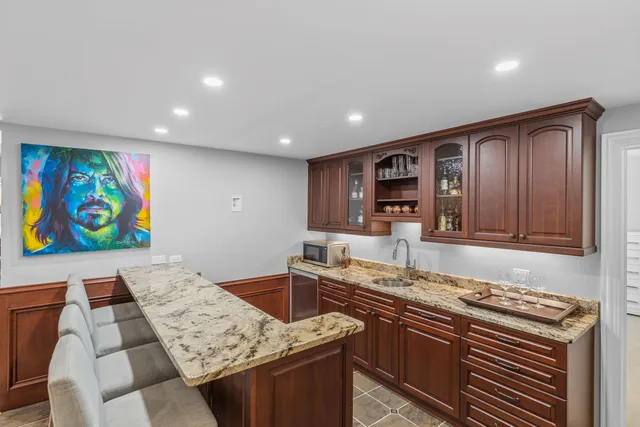 a bathroom with a granite countertop sink mirror and a