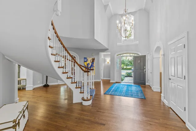 a living room with fireplace furniture and a large window