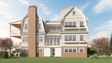 a front view of a residential apartment building with a yard