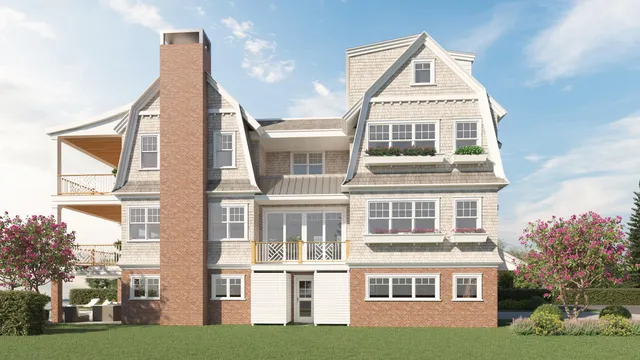 a front view of a residential apartment building with a yard