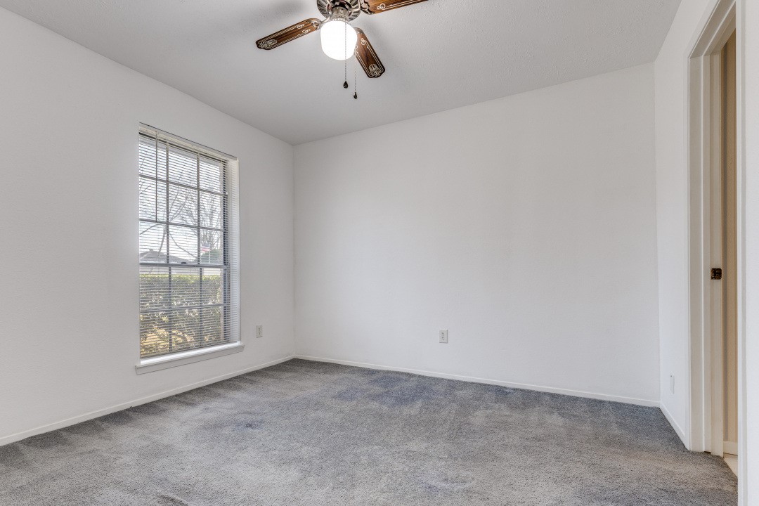 16210 Tibet Road Friendswood, TX 77546 - Photo 15 of 27 an empty room with windows
