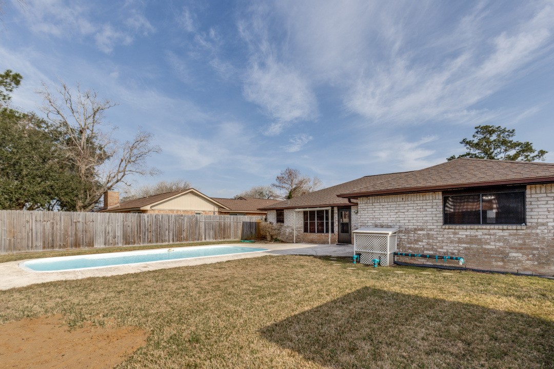 16210 Tibet Road Friendswood, TX 77546 - Photo 24 of 27 a front view of a house with a yard