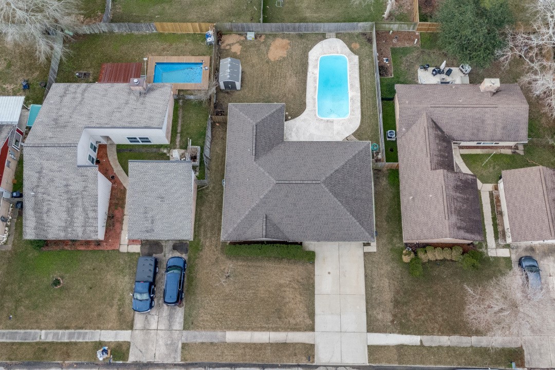 16210 Tibet Road Friendswood, TX 77546 - Photo 26 of 27 an aerial view of a house with a yard and a large tree
