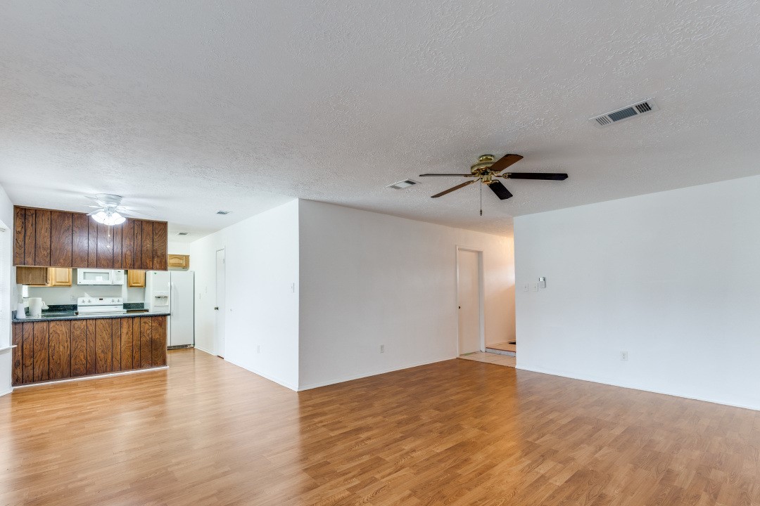 16210 Tibet Road Friendswood, TX 77546 - Photo 10 of 27 a view of a kitchen with a sink and a refrigerator
